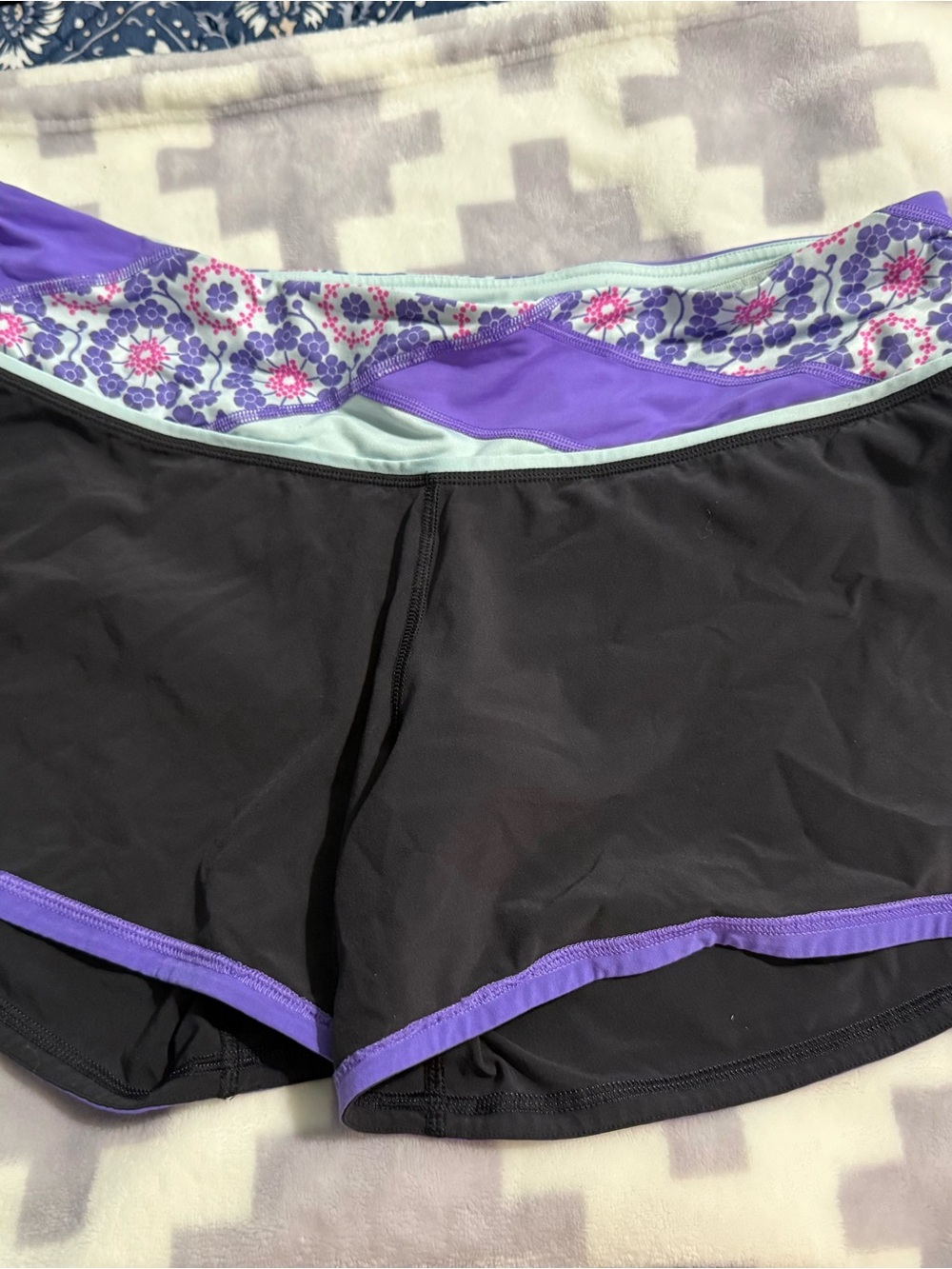 lululemon athletica Black Athletic Shorts with Purple Trim and Floral Waistband